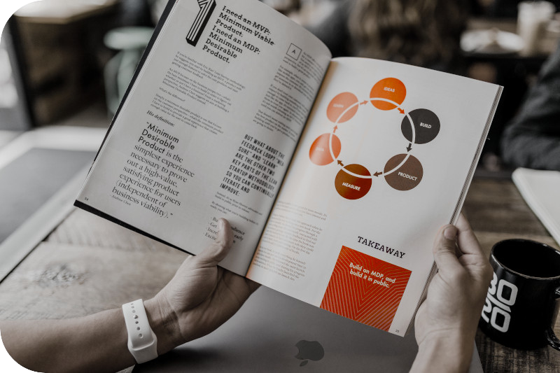 Hands hold a well designed brochure, which shows product information clearly
